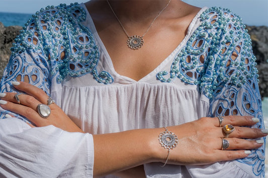 arms crossed fashion photo jewelry sun mandala necklace and bracelet sterling silver bohemian style boho chic for women